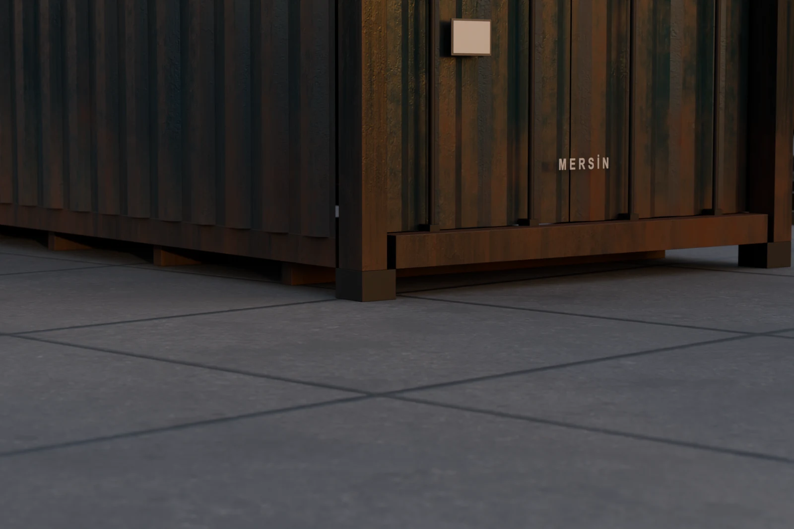 Close on a container's bottom corner casting, the cast steel block with an oval hole that every twist-lock engages.